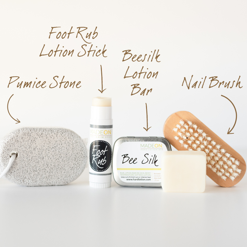 Dry, Cracked Feet Repair Kit against white background. Includes pumice stick, foot rub lotion bar stick, beesilk lotion bar and nail brush with text for each product