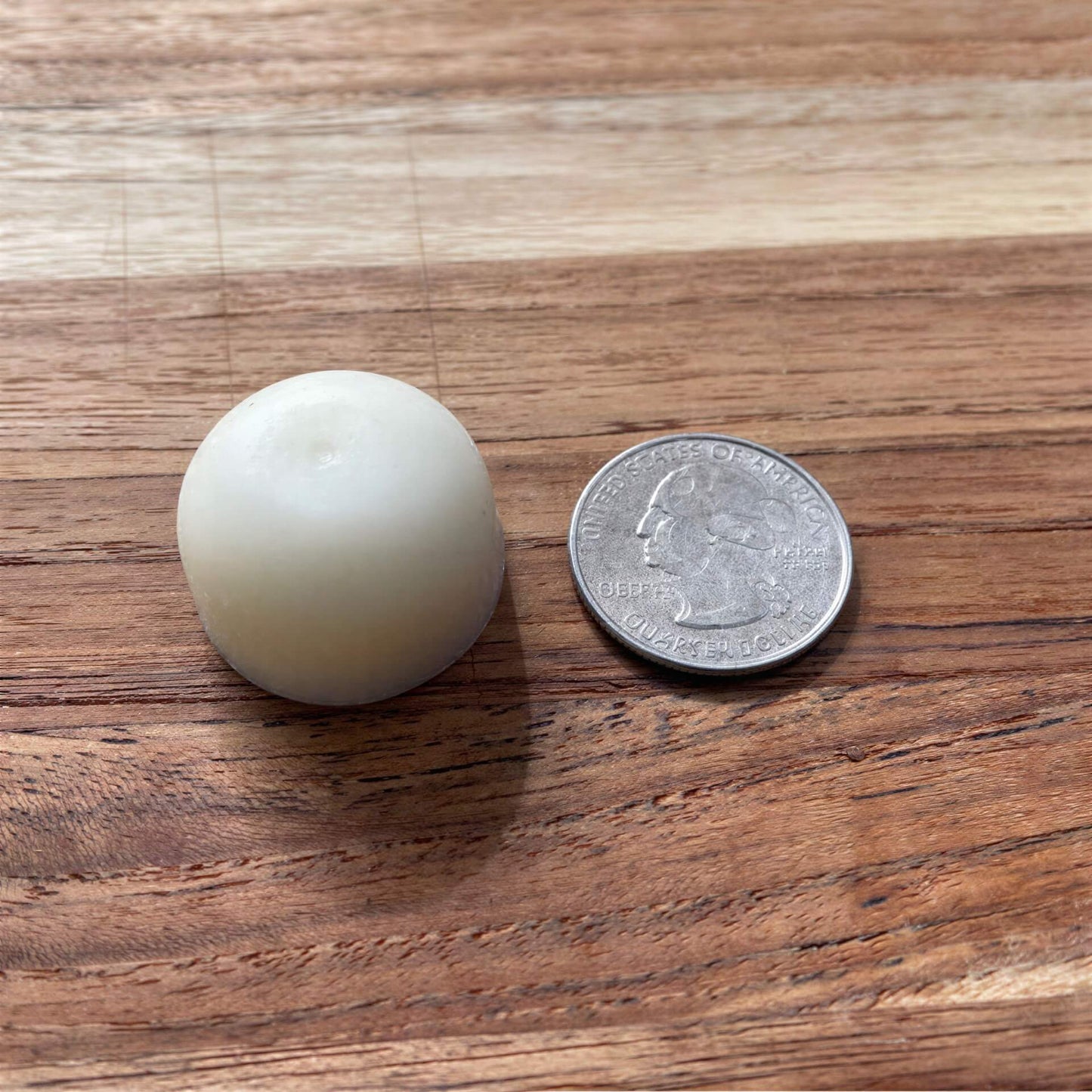 madeon sample lotion bar next to quarter