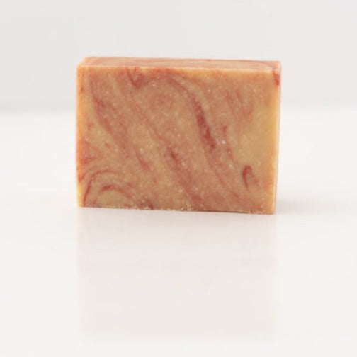 peppermint swirl goat milk soap on white background