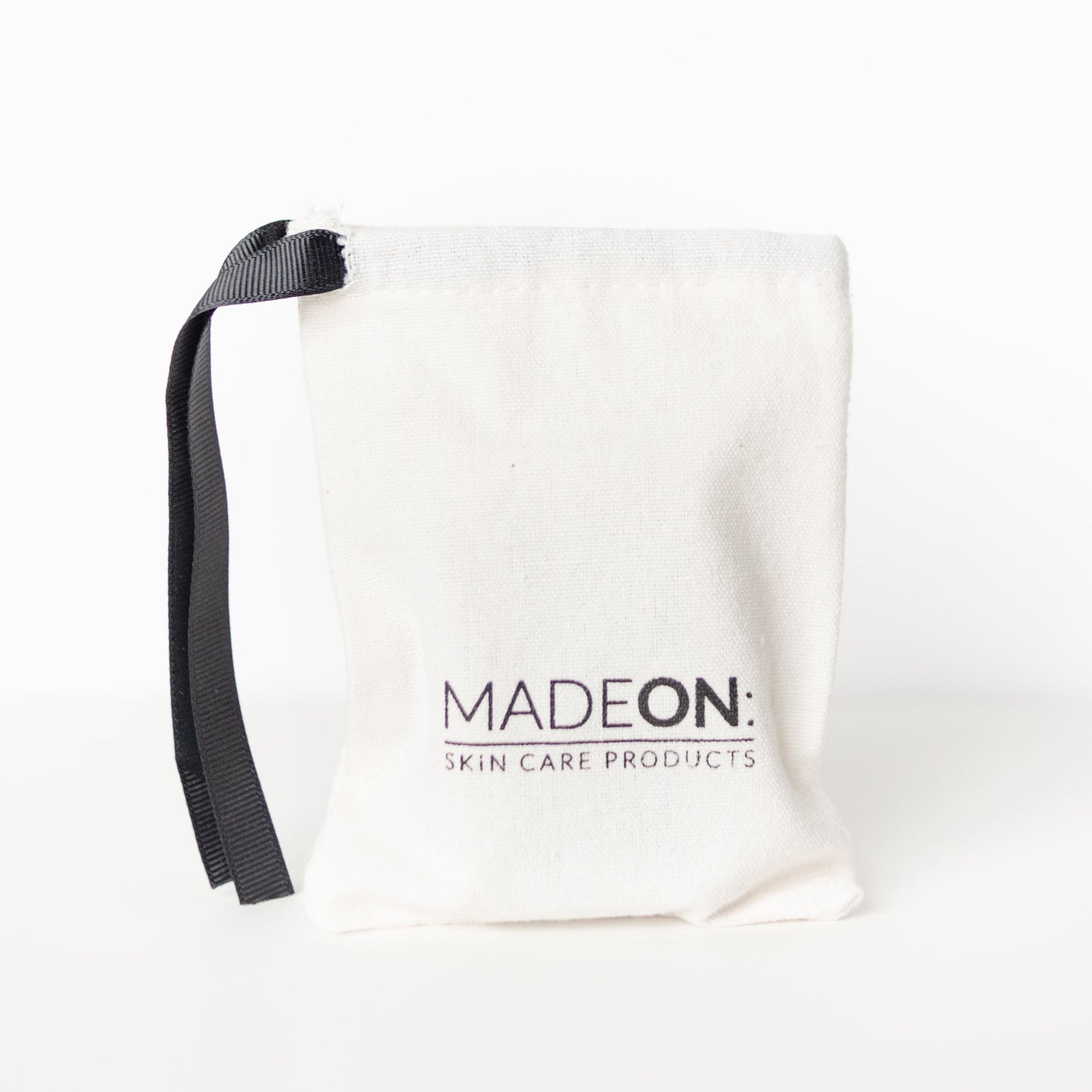 Gift bag against white background with MadeOn Logo on it
