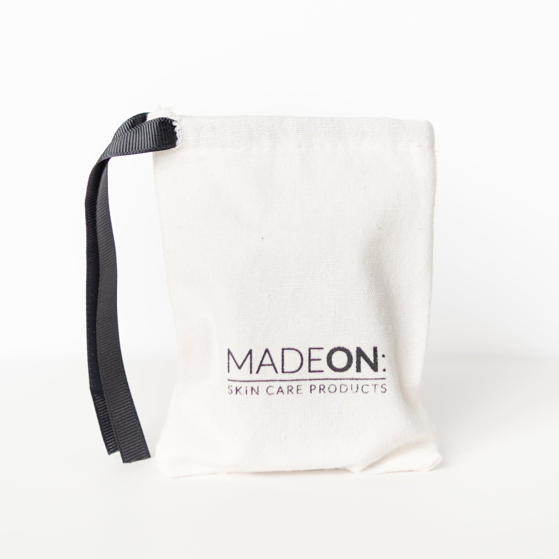Gift bag against white background with MadeOn Logo on it