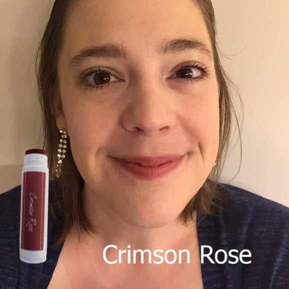 female showing crimson rose tinted lip balm made with iron oxide and only 4 ingredients.  Iron oxide based mineral lipstick.