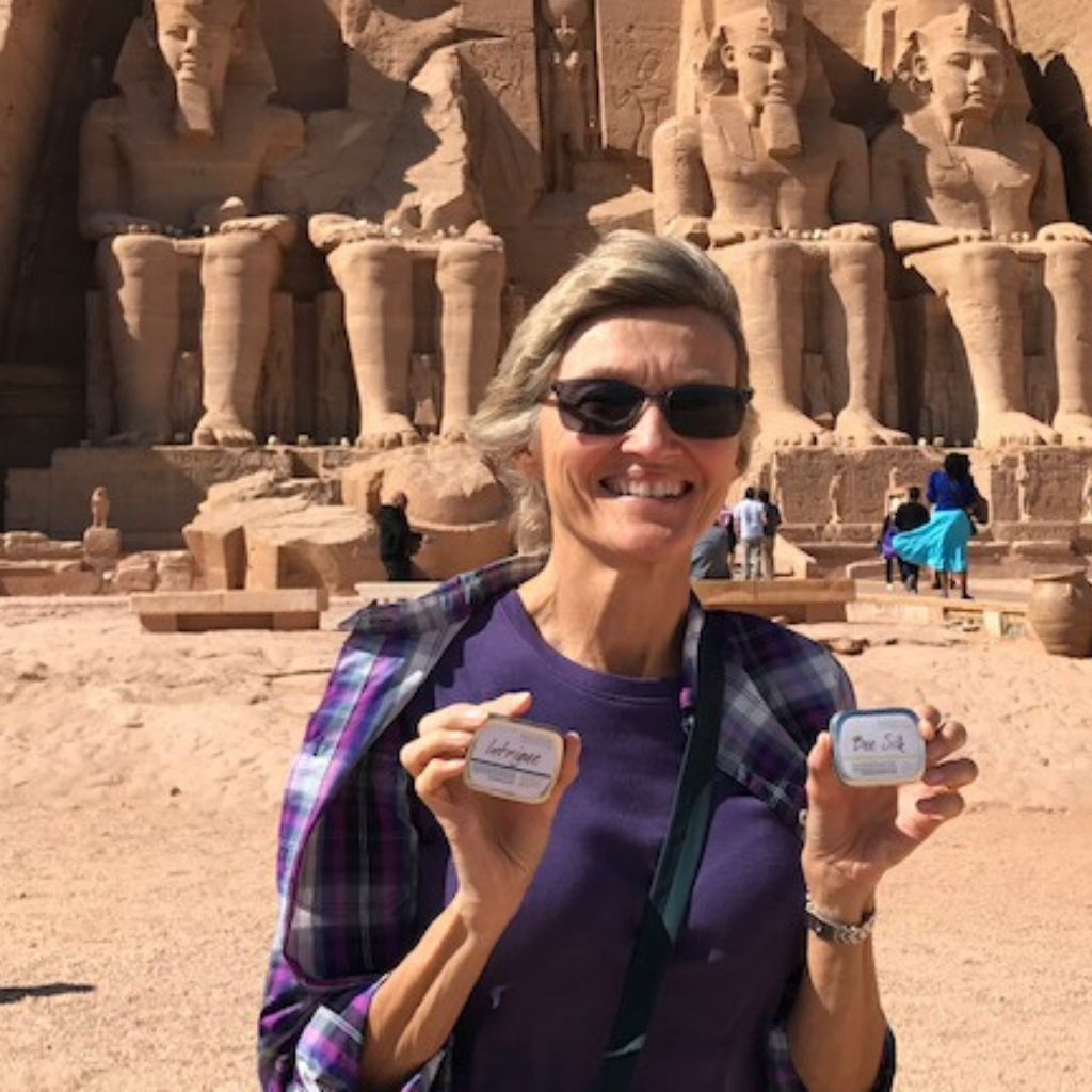 woman in egypt with her TSA, travel-friendly lotion bar, perfect for dry skin