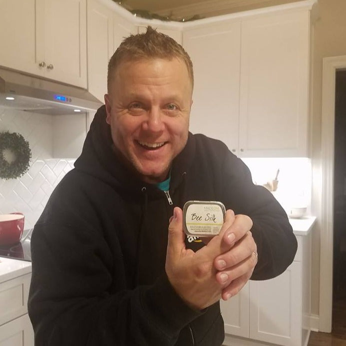 man holding beesilk lotion bar