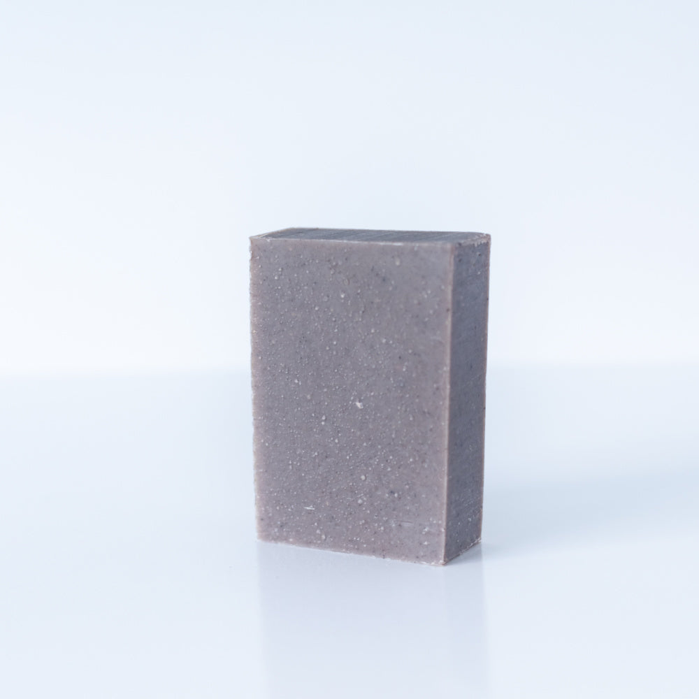 pumice goat milk soap on white background