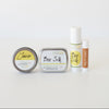 Beesilk in emollient, lotion stick, lotion bar and lip balm form against white background