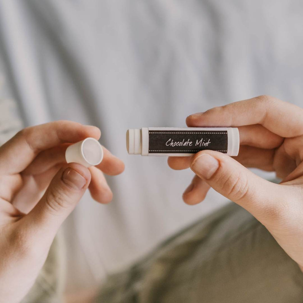 woman holding lip balm