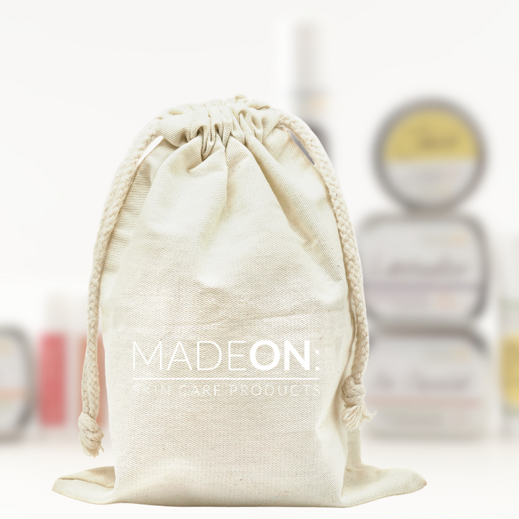 gift bag with several blurred MadeOn products in background