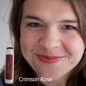 female showing Crimson Rose tinted lip balm made with iron oxide and only 4 ingredients
