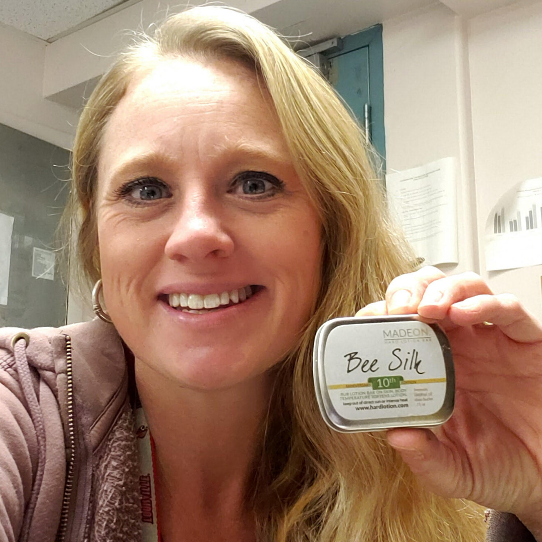 woman holding a beesilk lotion bar