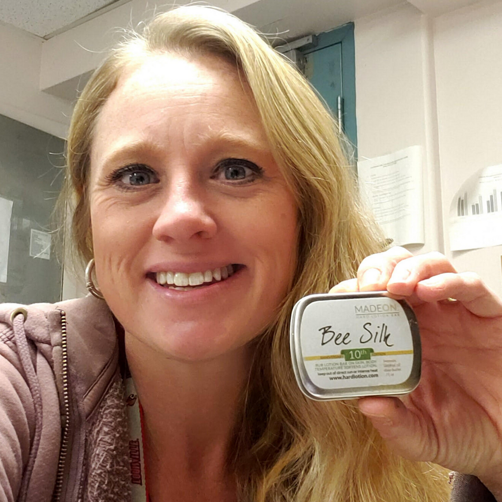 woman holding a beesilk lotion bar