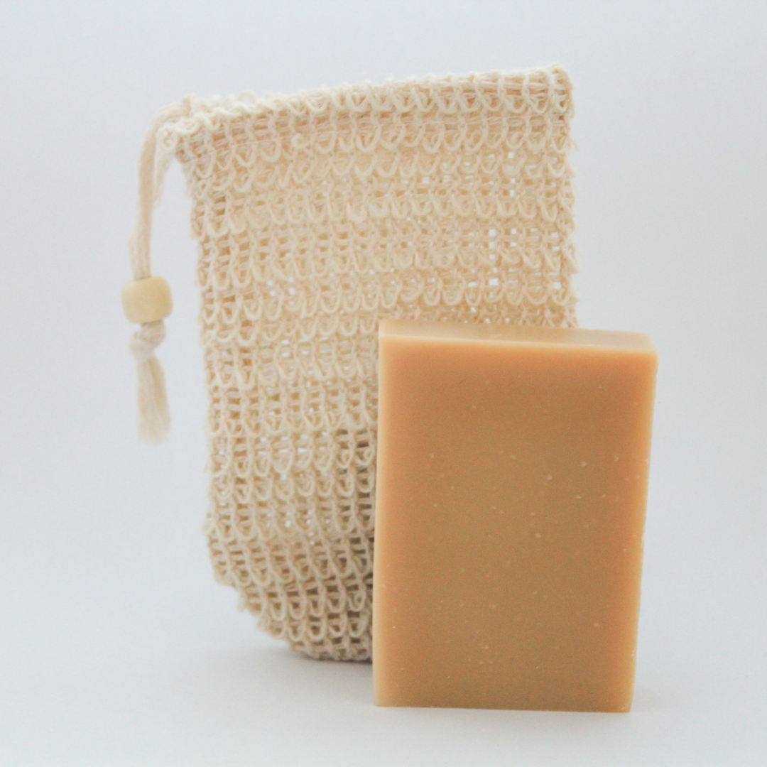 mesh soap bag with bar of goat milk soap